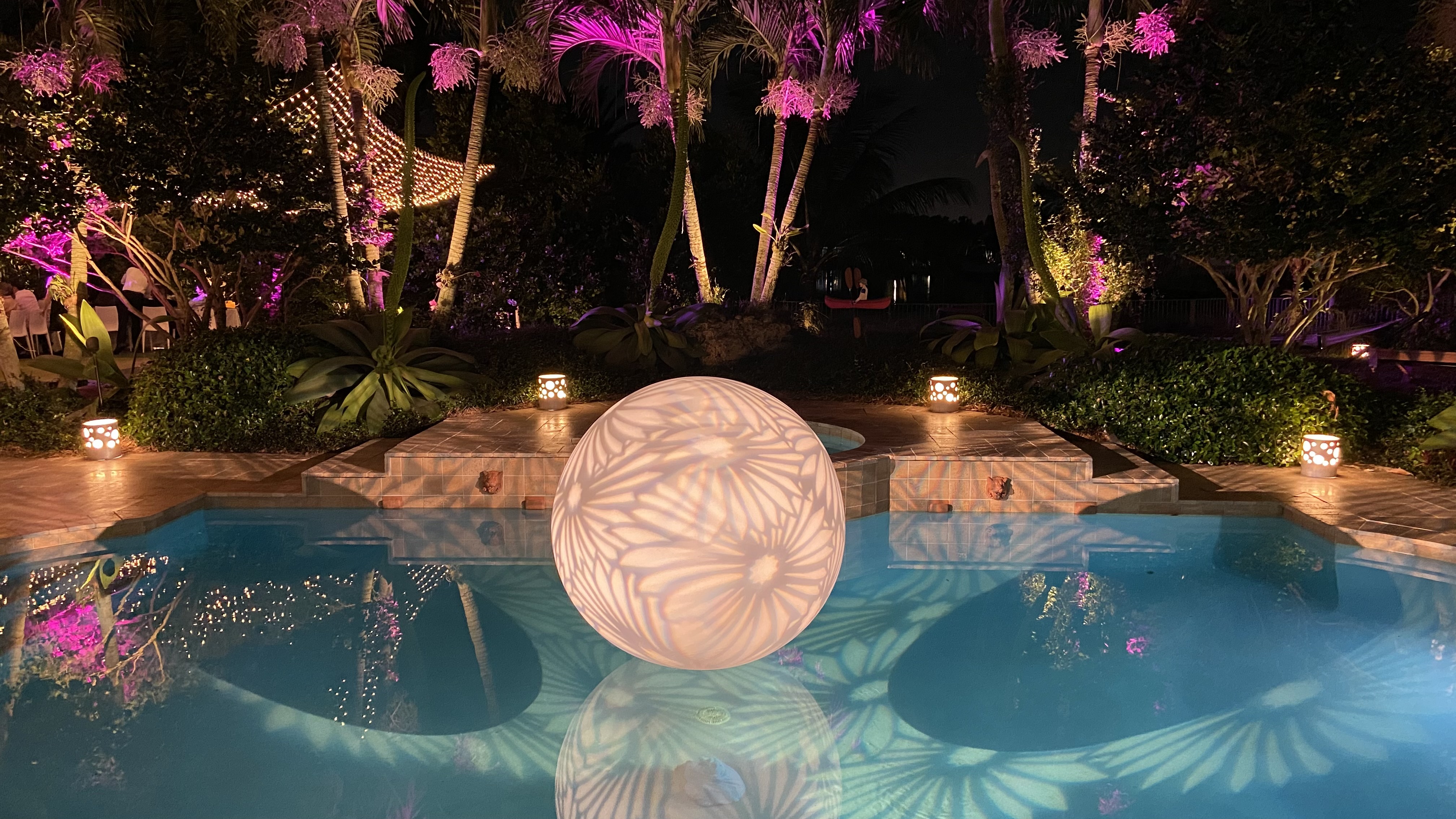 Lighting, birthday celebration, sphere in pool with flower patterns, private residence, Cooper City, FL